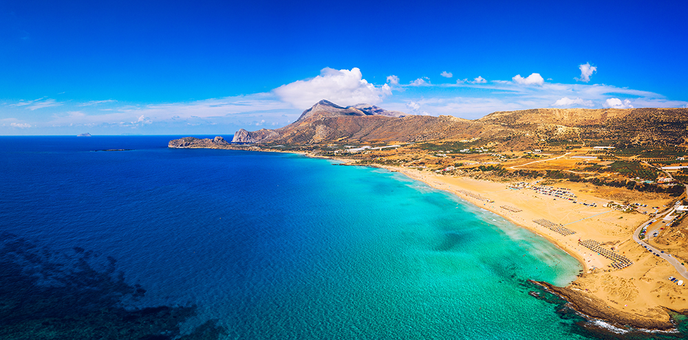 Aerial shot of beautiful turquoise beach Falasarna (Falassarna) Aerial shot of beautiful turquoise beach Falasarna (Falassarna) in Crete, Greece. View of famous paradise sandy deep turquoise beach of Falasarna (Falassarna) in North West, Crete island, Greece.