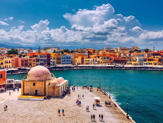 Mosque in the old Venetian harbor of Chania town on Crete island Mosque in the old Venetian harbor of Chania town on Crete island, Greece. Old mosque in Chania. Janissaries or Kioutsouk Hassan Mosque in Chania Crete. Turkish mosque in Chania bay. Crete, Greece.